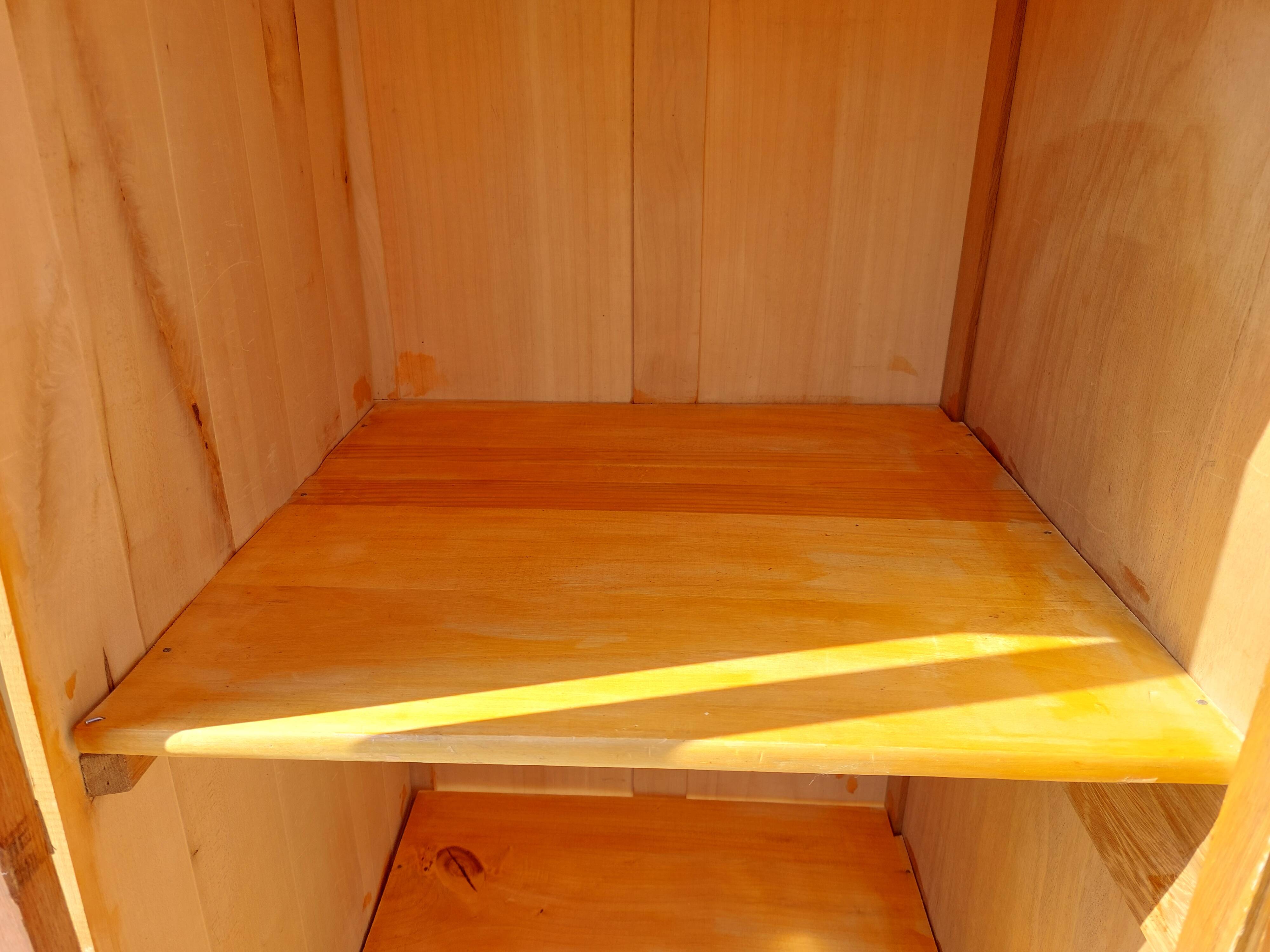 Vintage wardrobe with mirror and tapered legs.