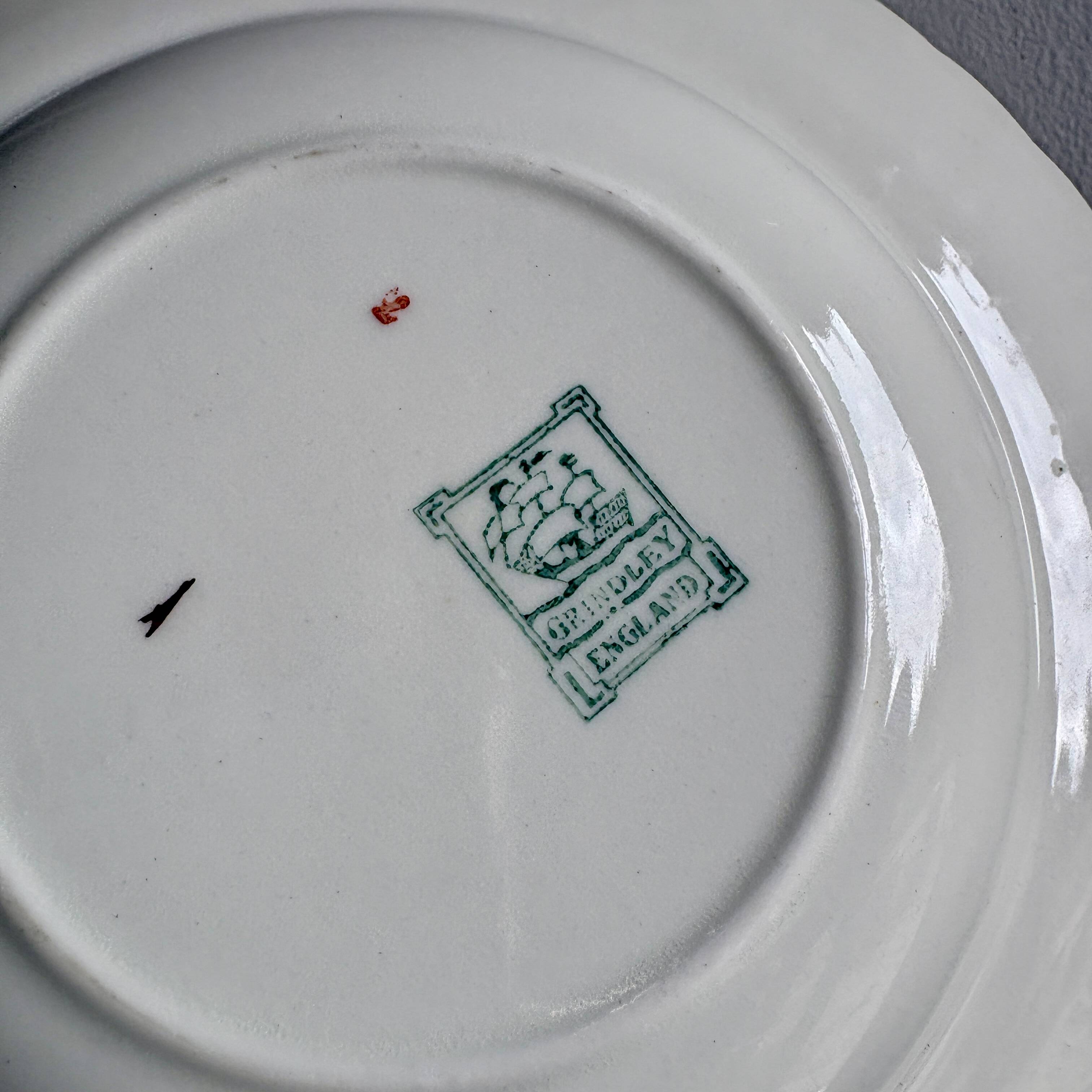 Set of 6 mismatched antique deep plates.