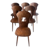 Set of six plywood dining chairs by Baumann, France, 1950s.