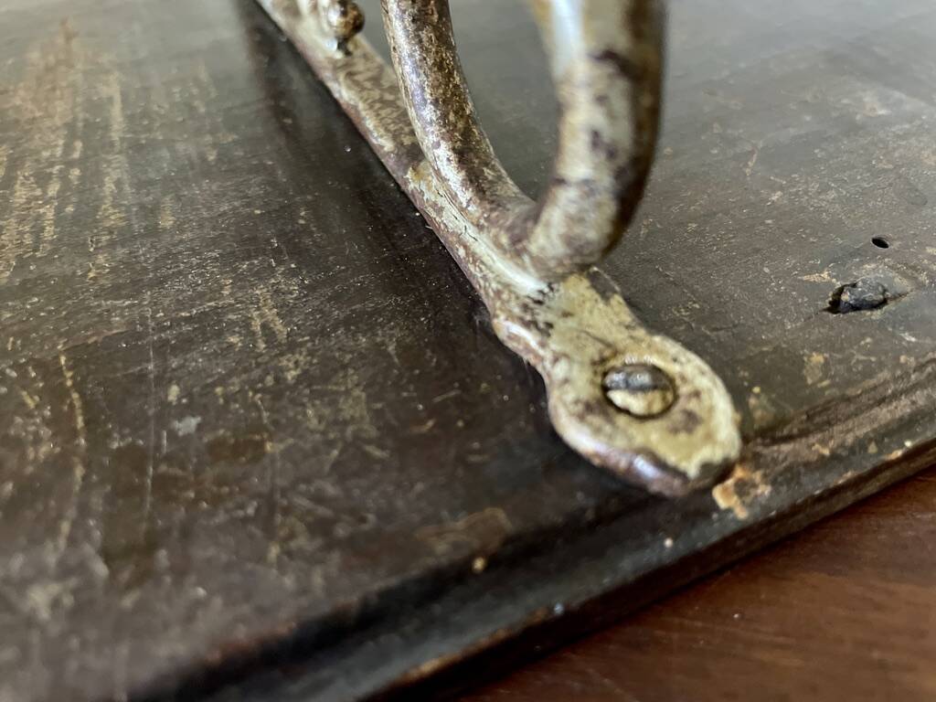 Patinated wood and metal coat rack from the 1950s.