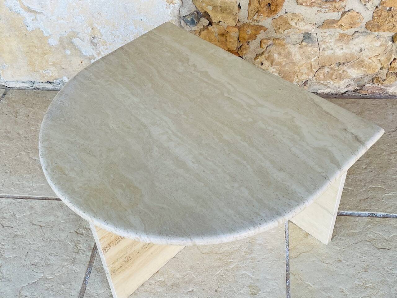 Vintage side table in travertine, circa 1980s.