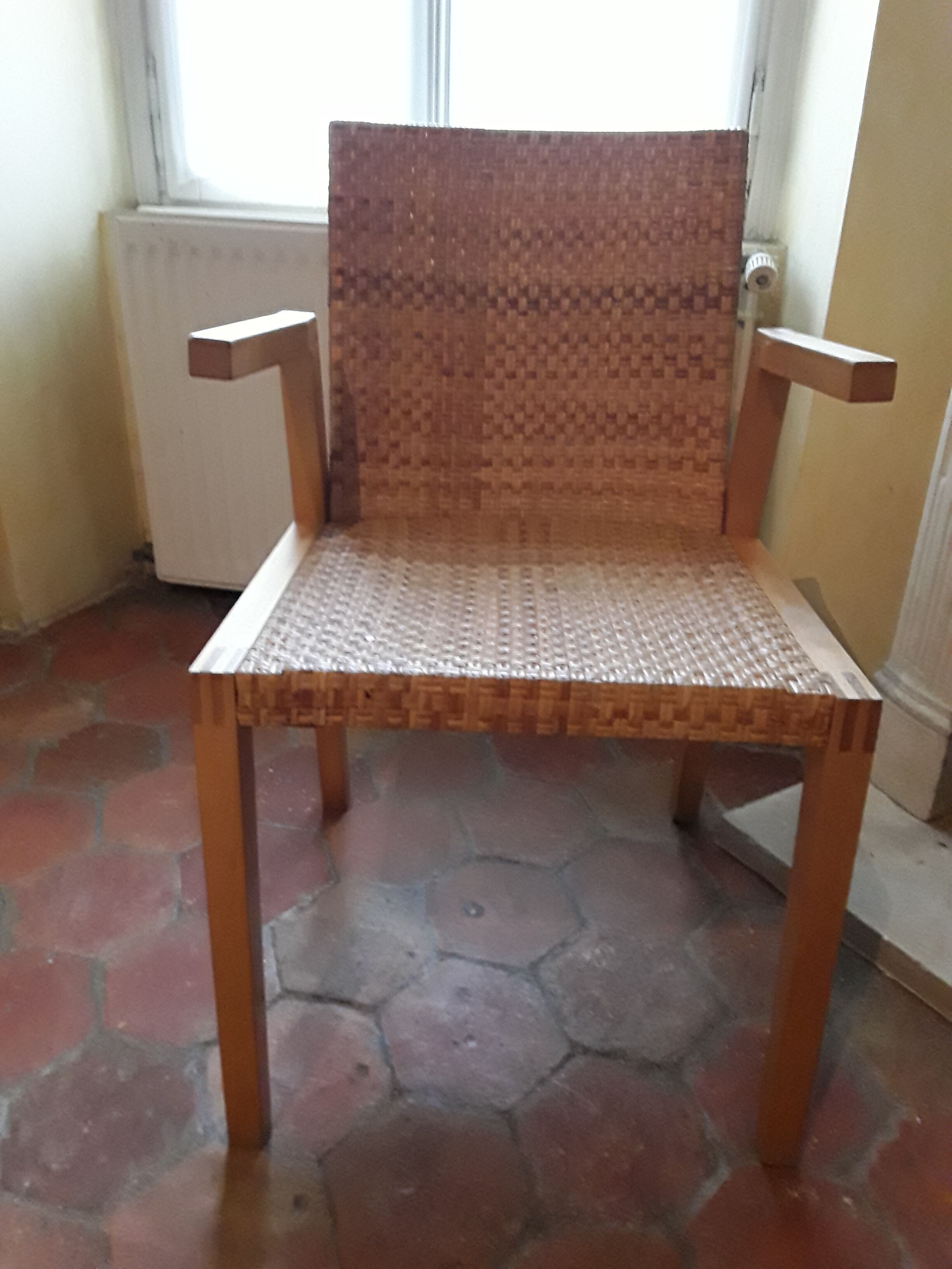 Two vintage braided straw armchairs