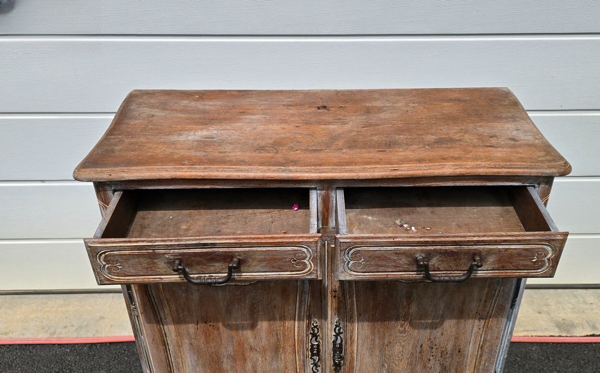 Antique chest of drawers with a cerused and patinated finish.