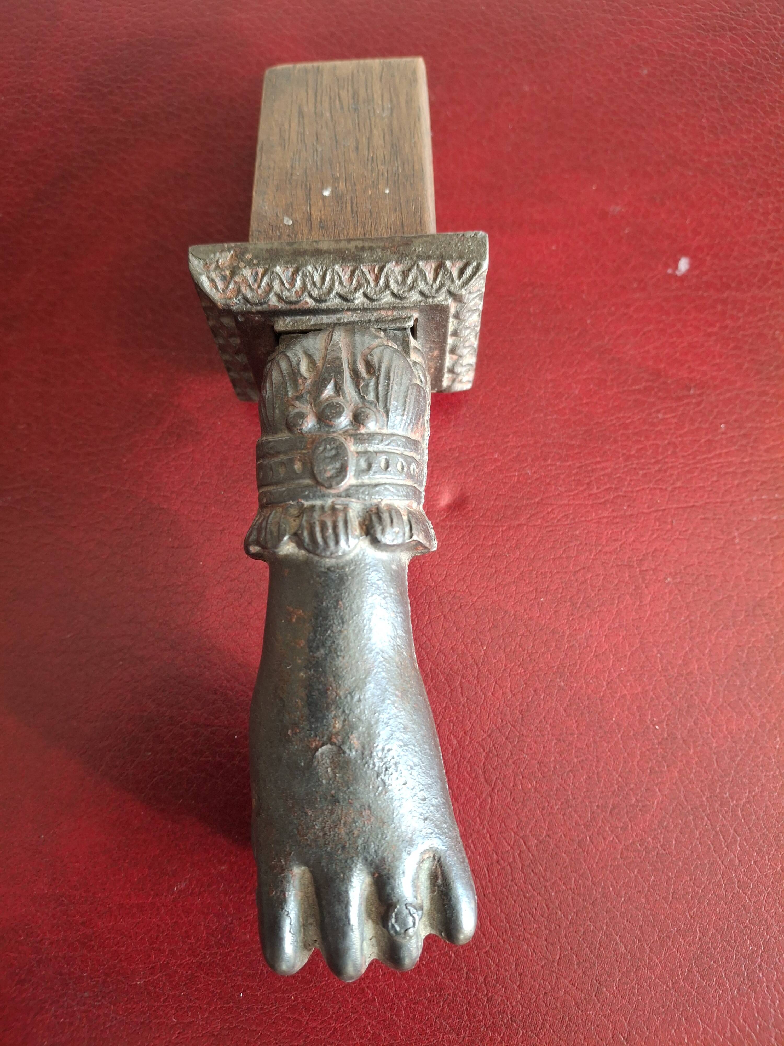 Cast iron door knocker from the 19th century or earlier.