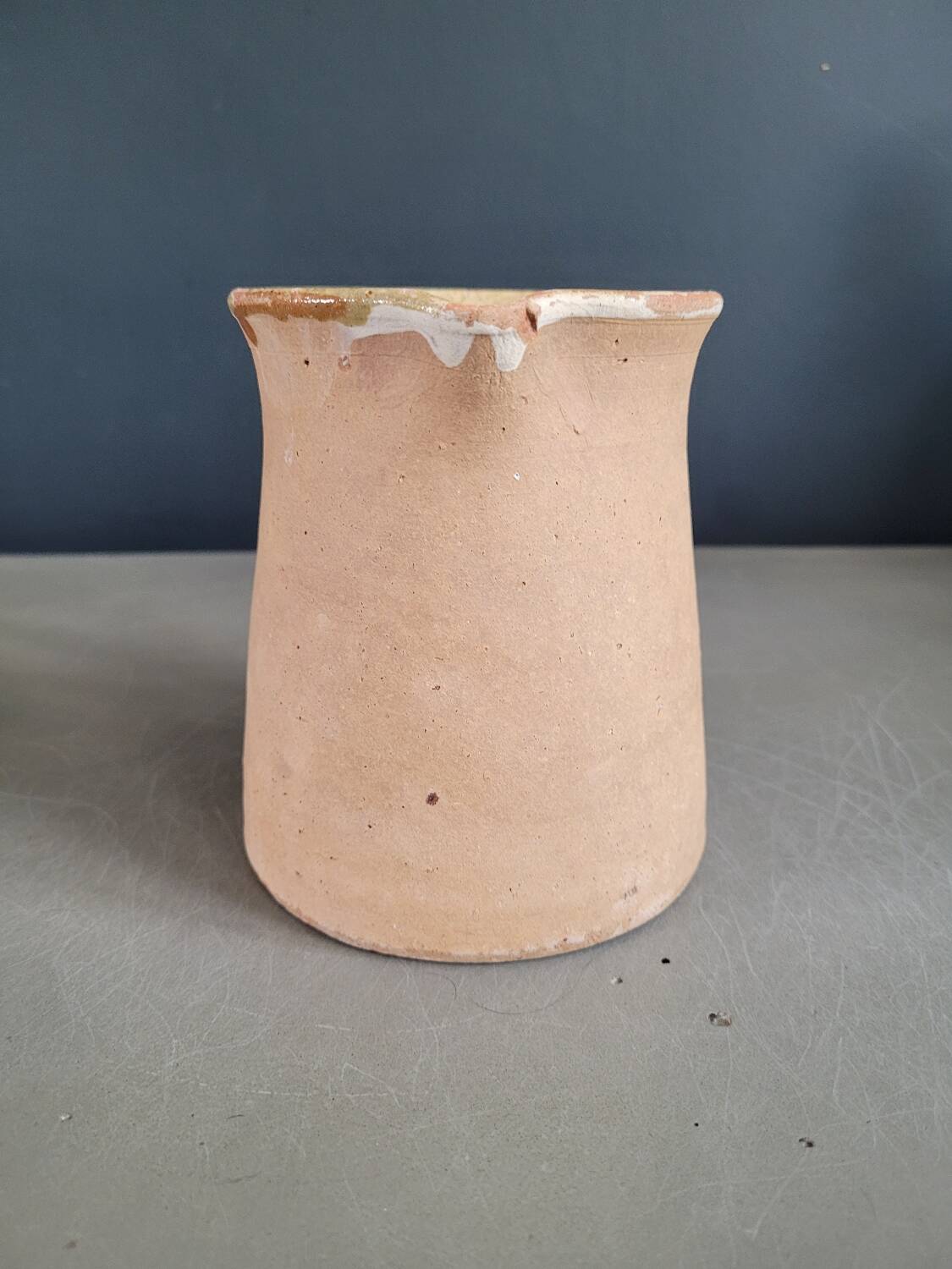 Antique milk jug in glazed terracotta