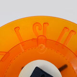 Guzzini orange wall clock from the 1980s