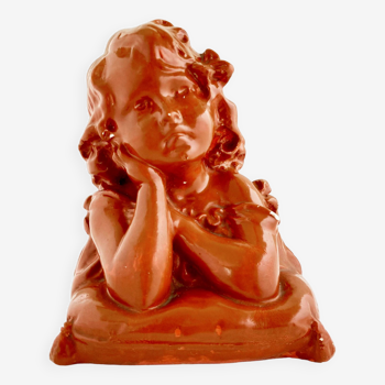 Bust of a pensive child in plaster