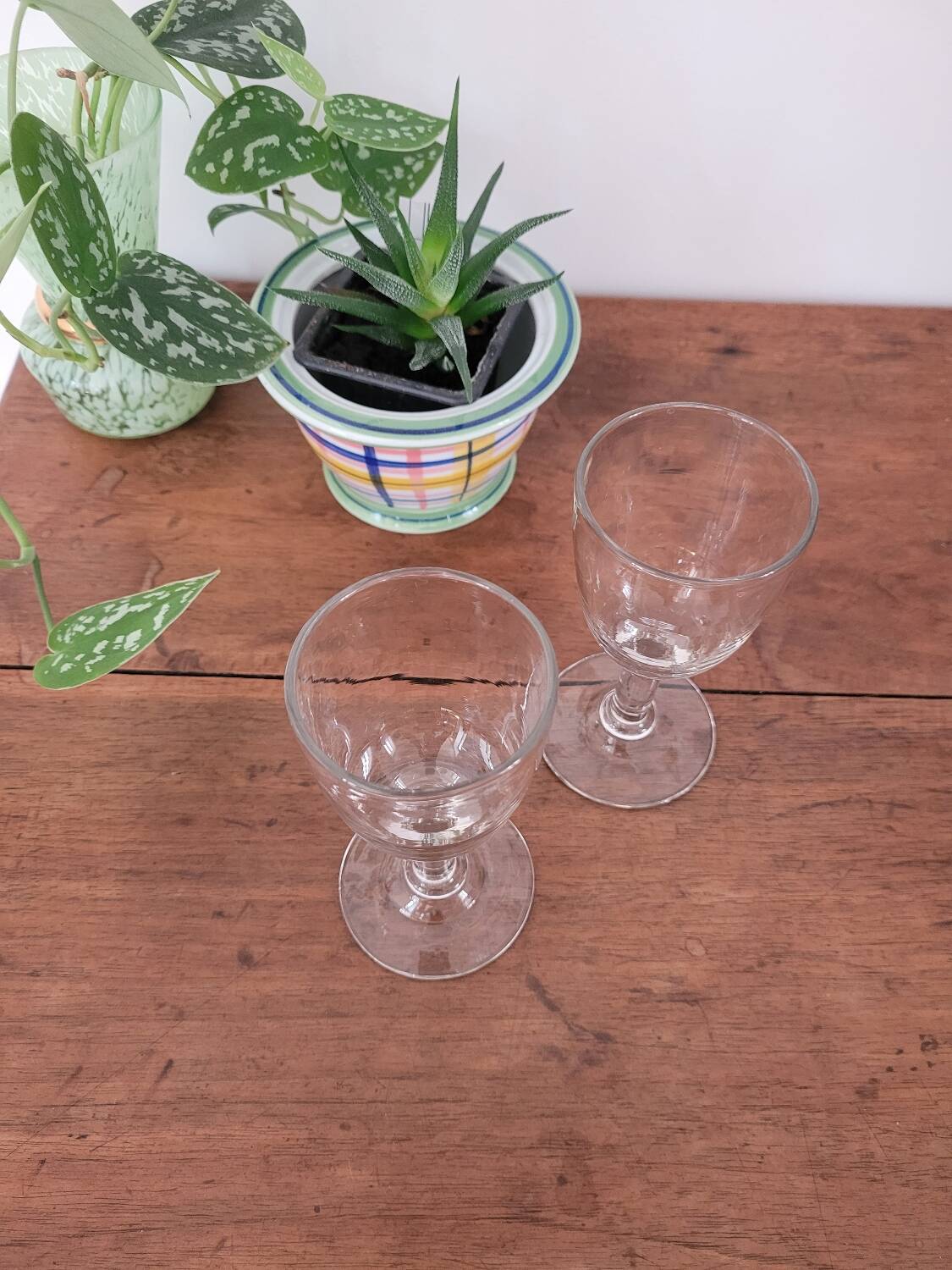2 small stemmed glasses