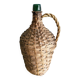 Antique demijohn made of glass and woven wicker