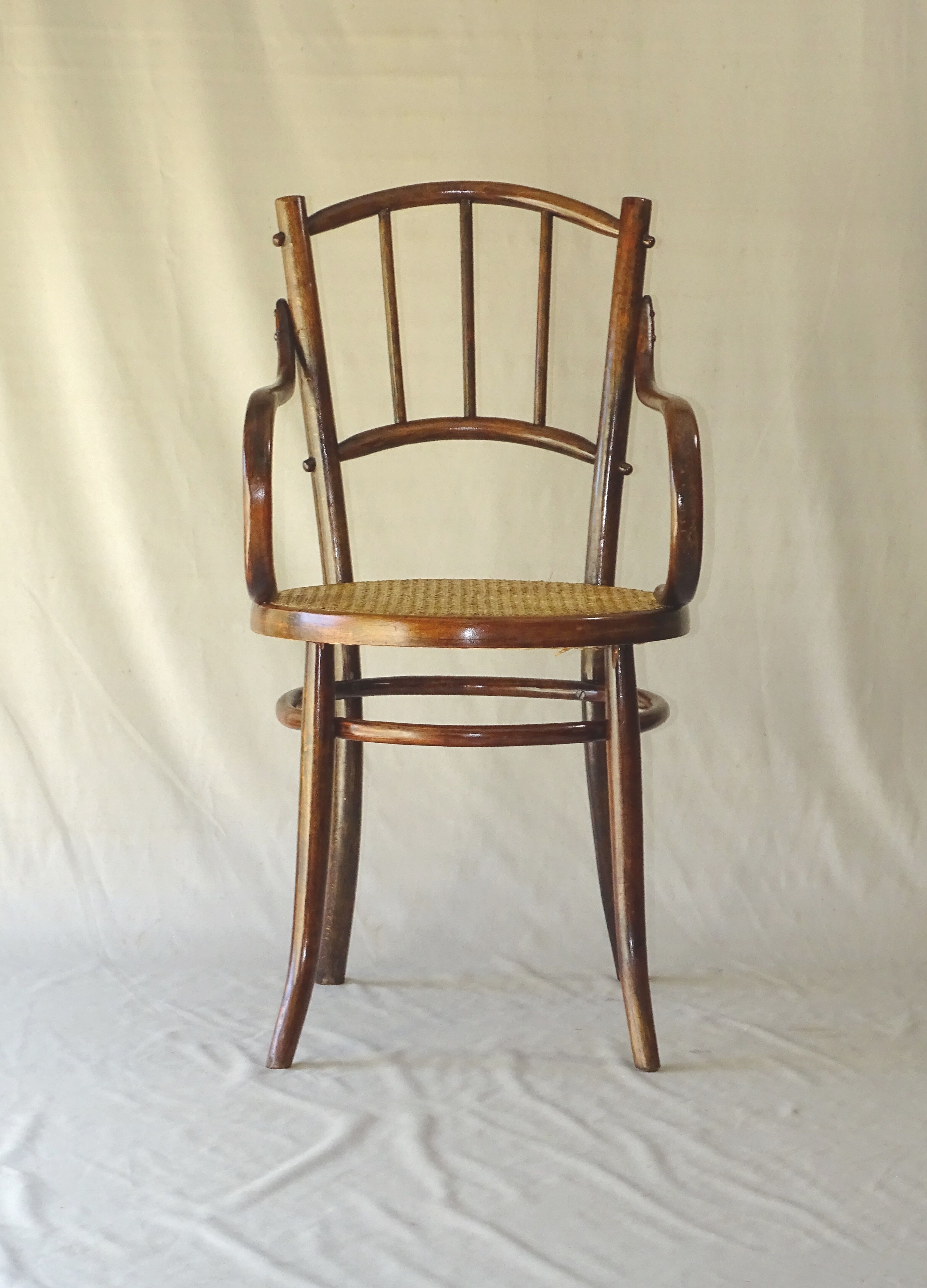 Small canned armchair; in curved wood, bistro, 1890
