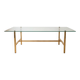 Vintage coffee table with glass and gold metal.