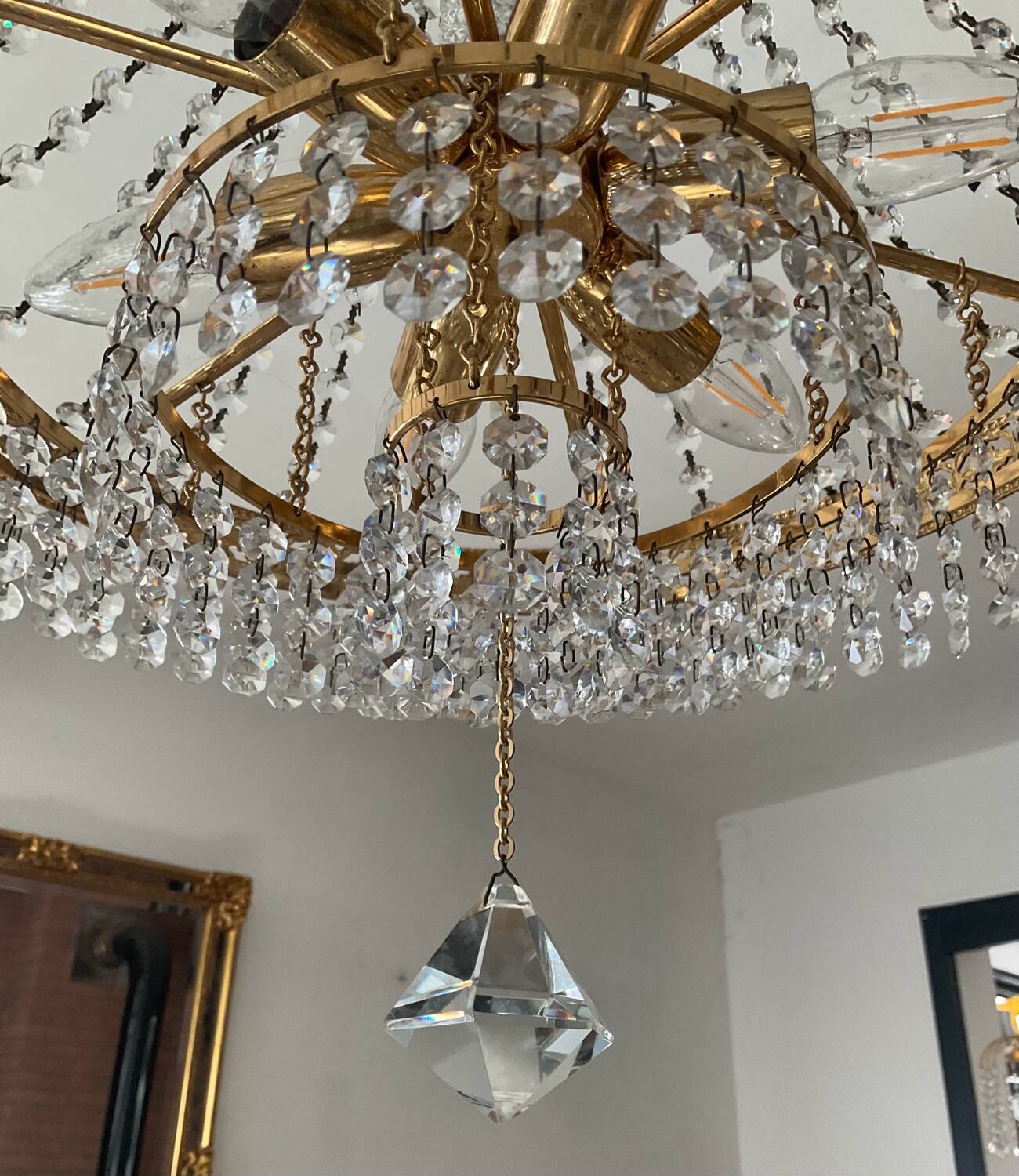 Brass hot air balloon chandelier with cascade of tassels