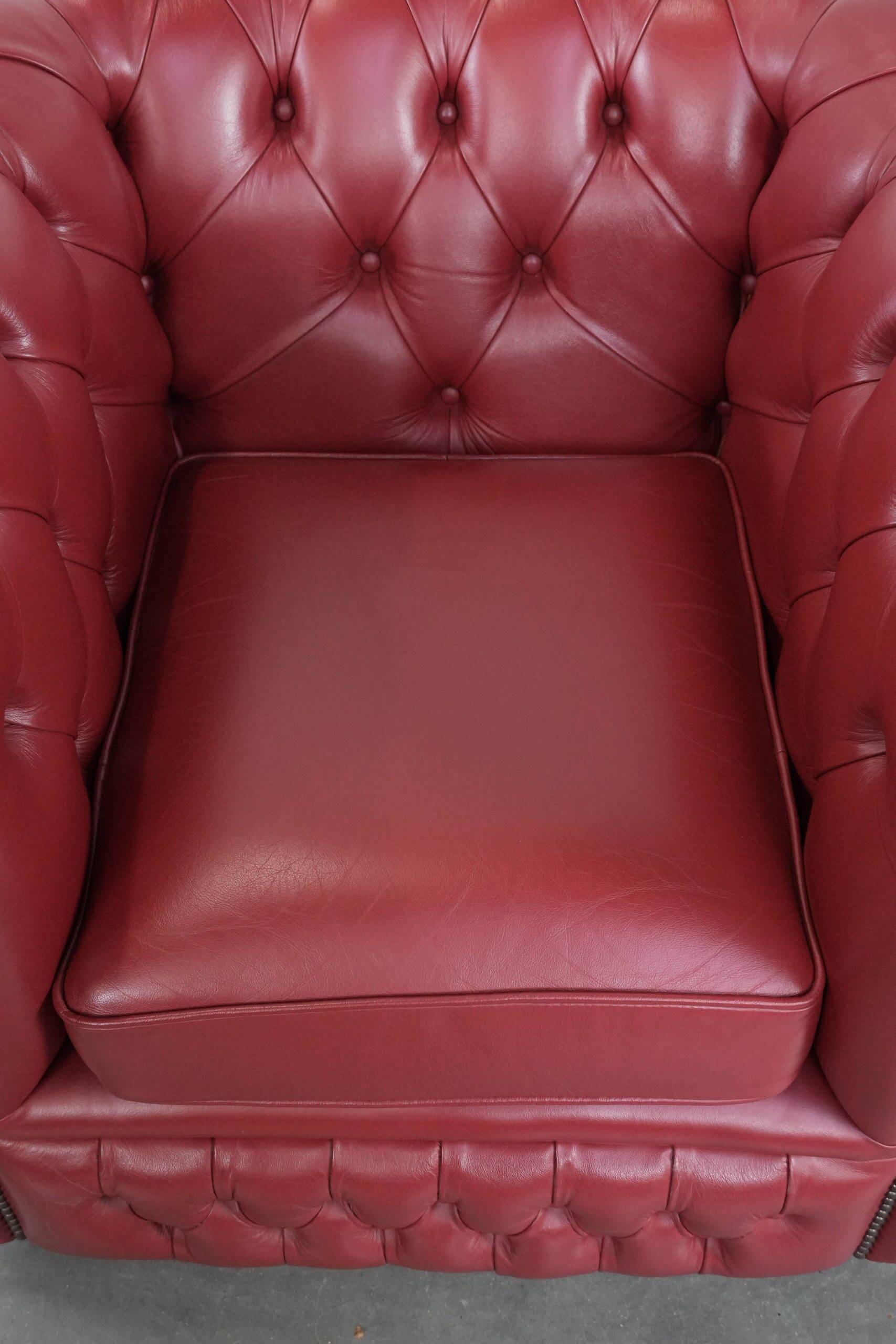Amazing English cowhide Chesterfield armchair in a stunning red colour