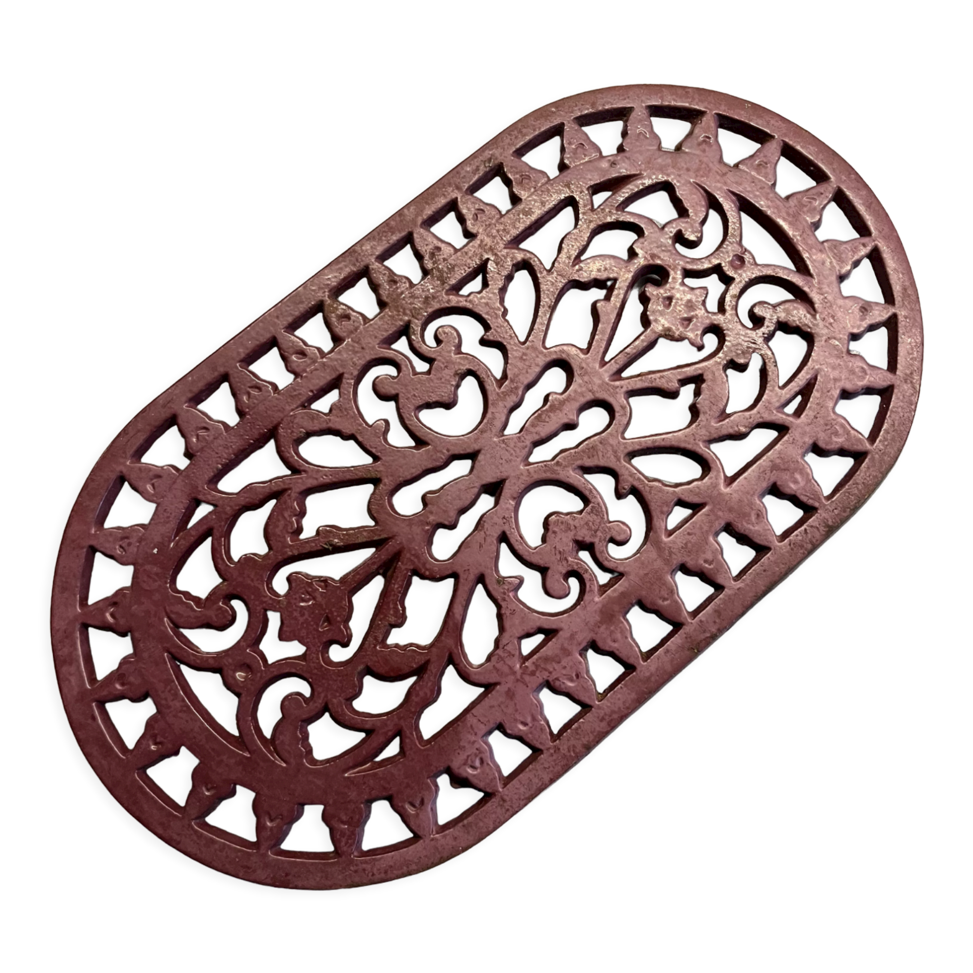 Old cast iron table mat