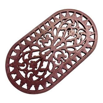 Old cast iron table mat