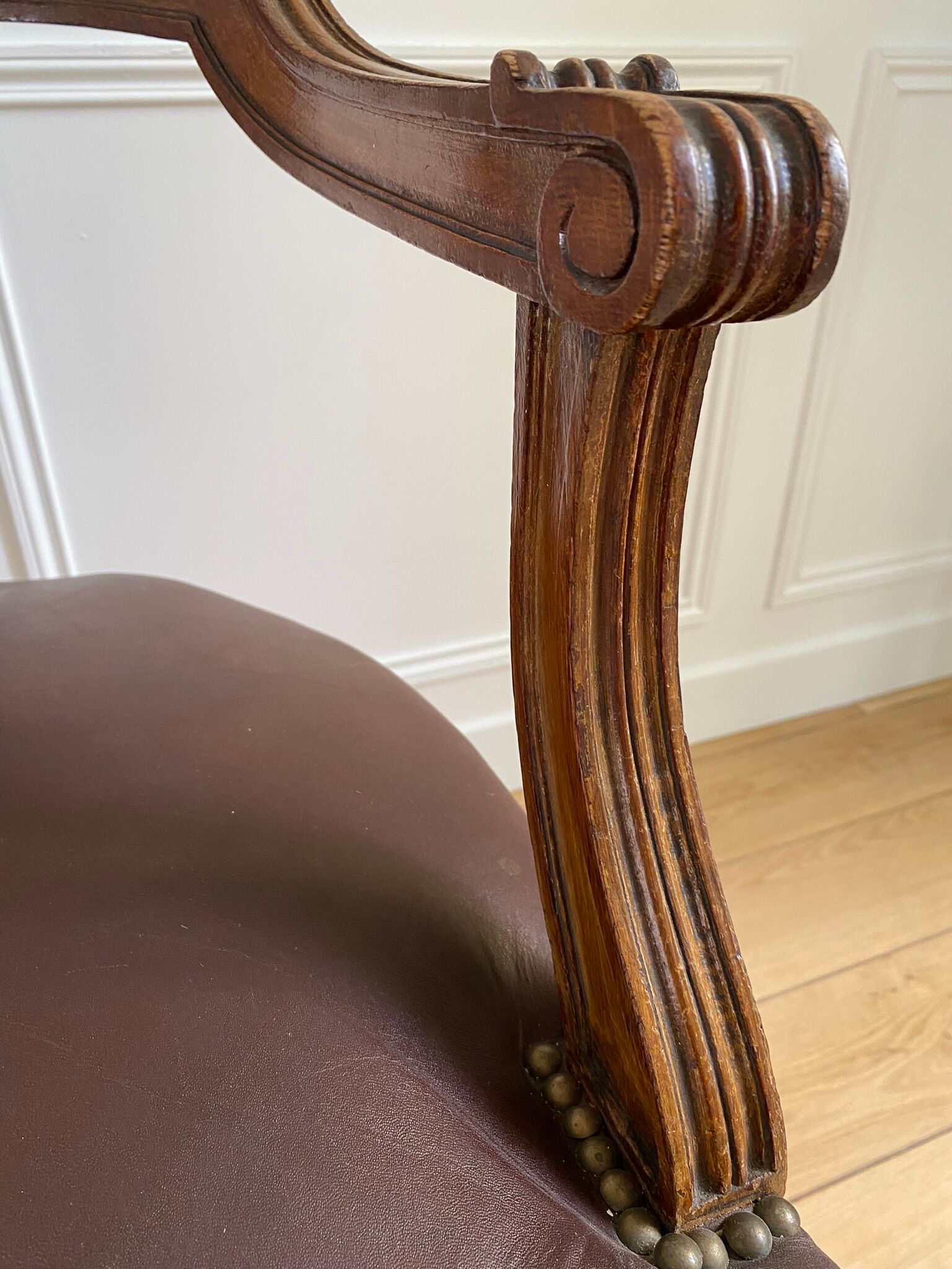 Vintage office chair in wood and brown studded leather late nineteenth