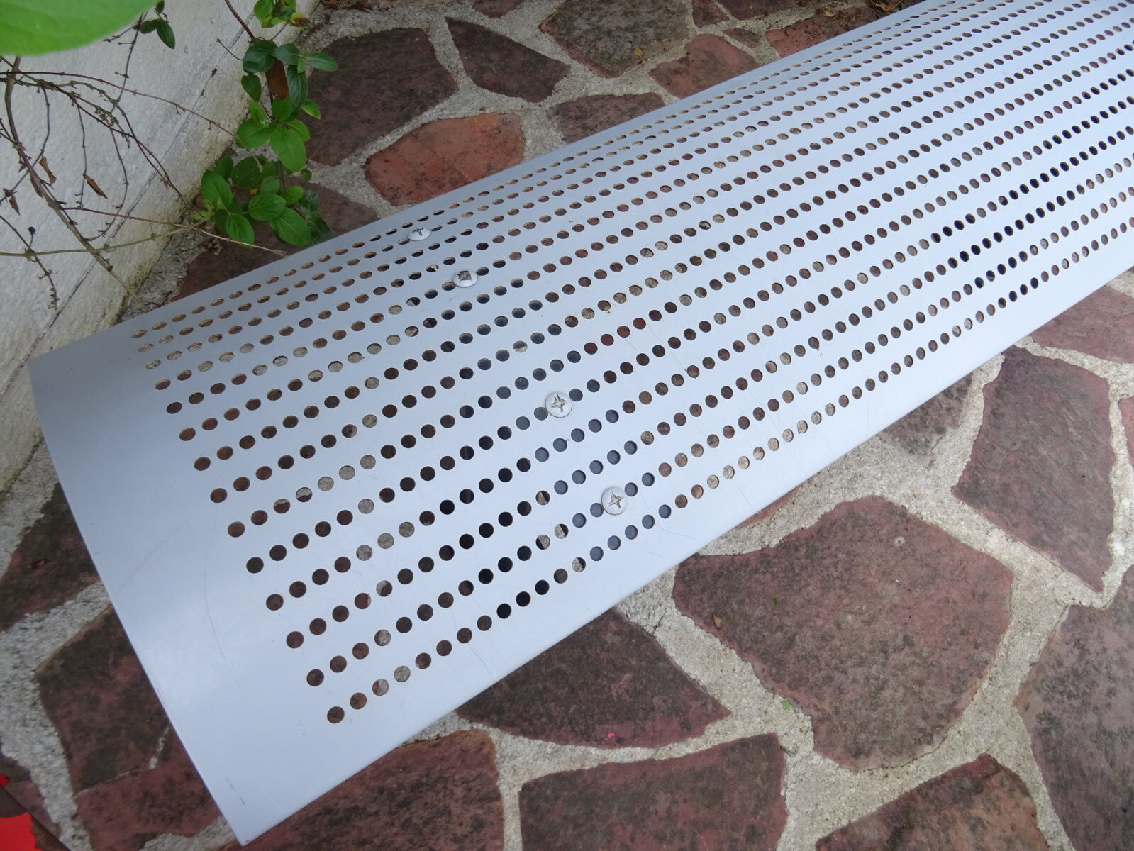 Perforated metal bench
