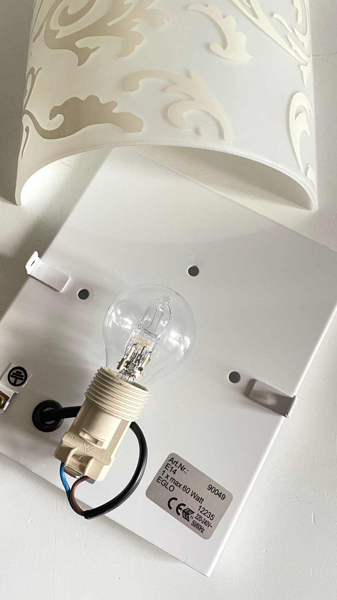 Polished and screen-printed glass sconce by eglo