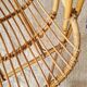 Vintage adult rattan armchair from the 1960s.