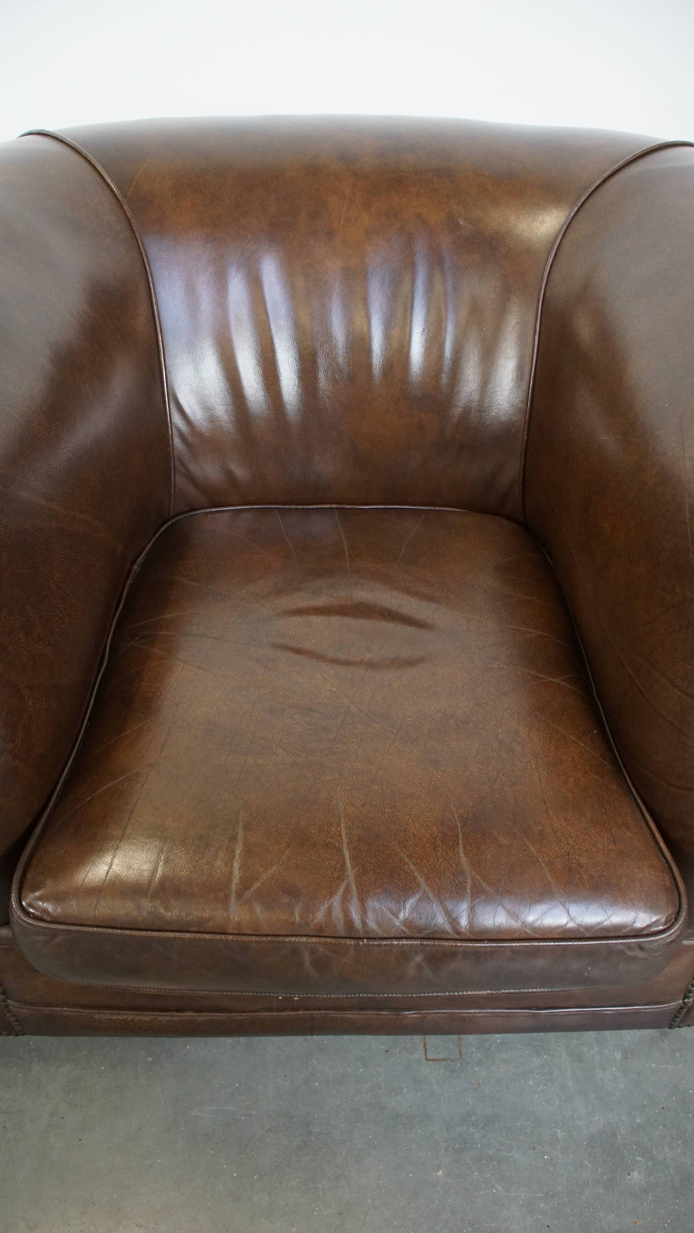 2 Chesterfield armchairs in dark brown cowhide