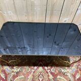 Neoclassical style coffee table with glass