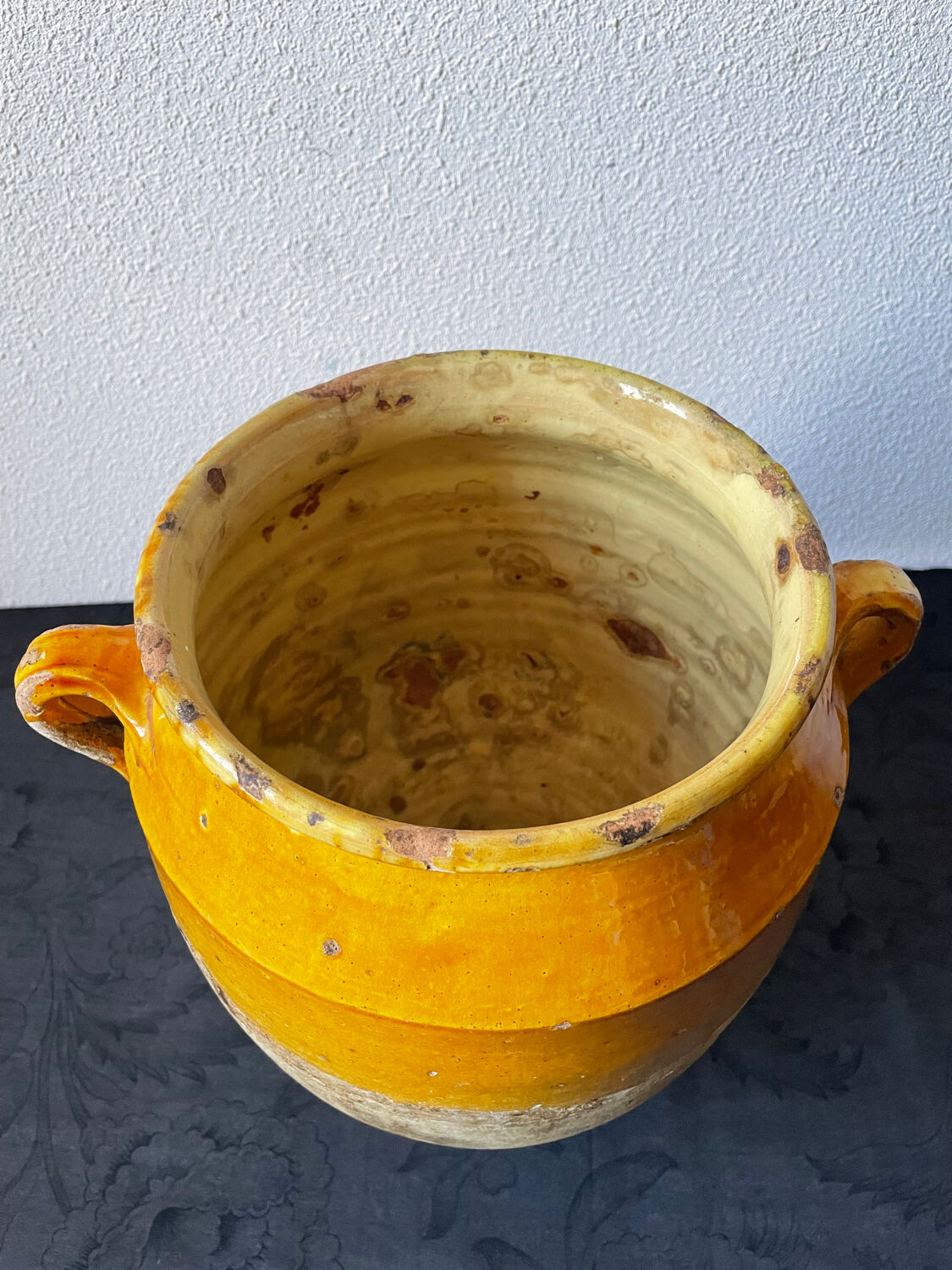 Old yellow glazed terracotta grease pot south west France