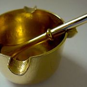 Three "vintage" bronze ashtrays with golden natural patina forming mortars with their drumsticks