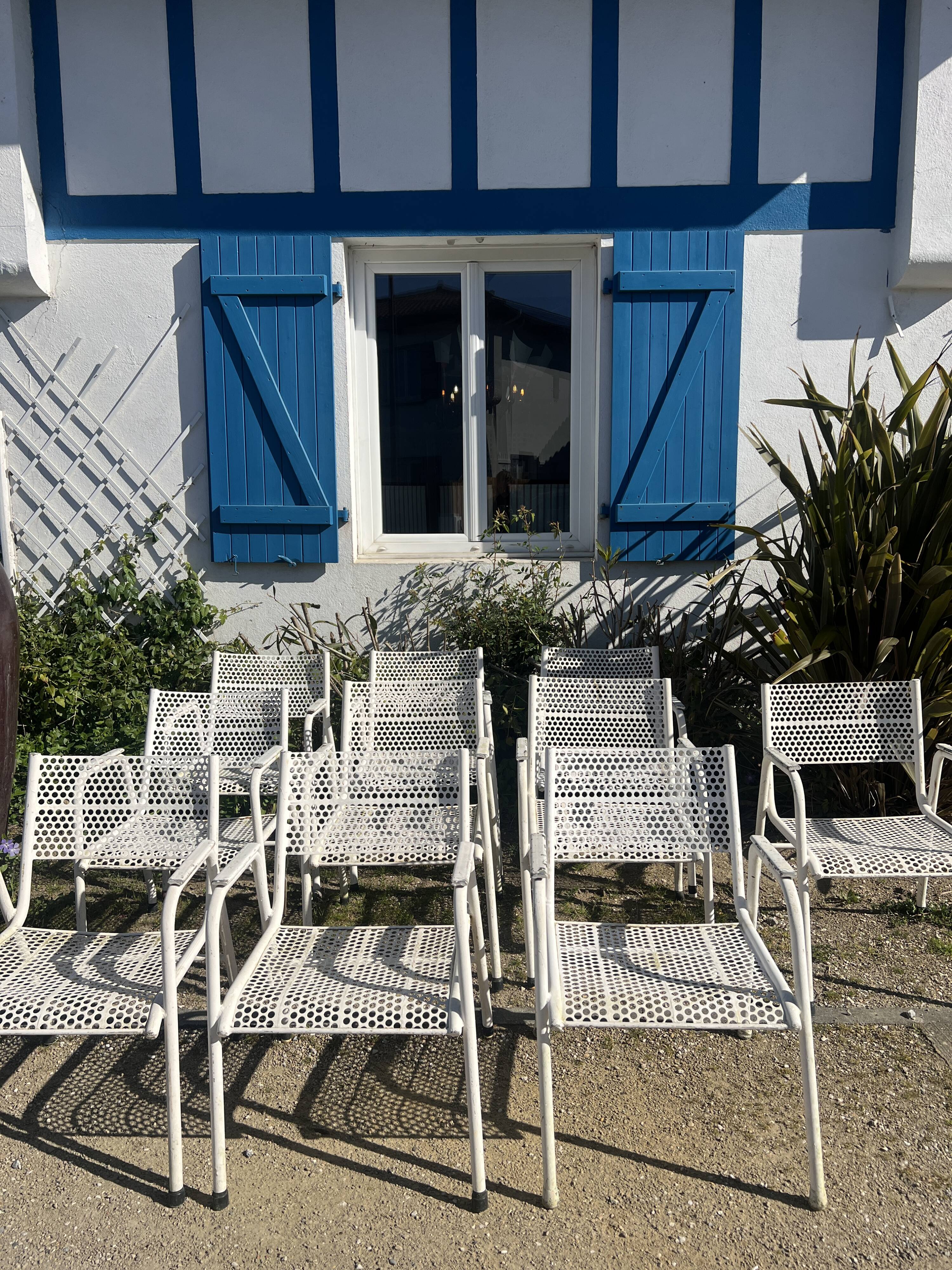 Set of 10 perforated metal garden chairs