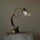 Sculptural table lamp in brass and opaline glass, early 20th century.