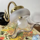 Swan neck wall light in brass with glass tulip.