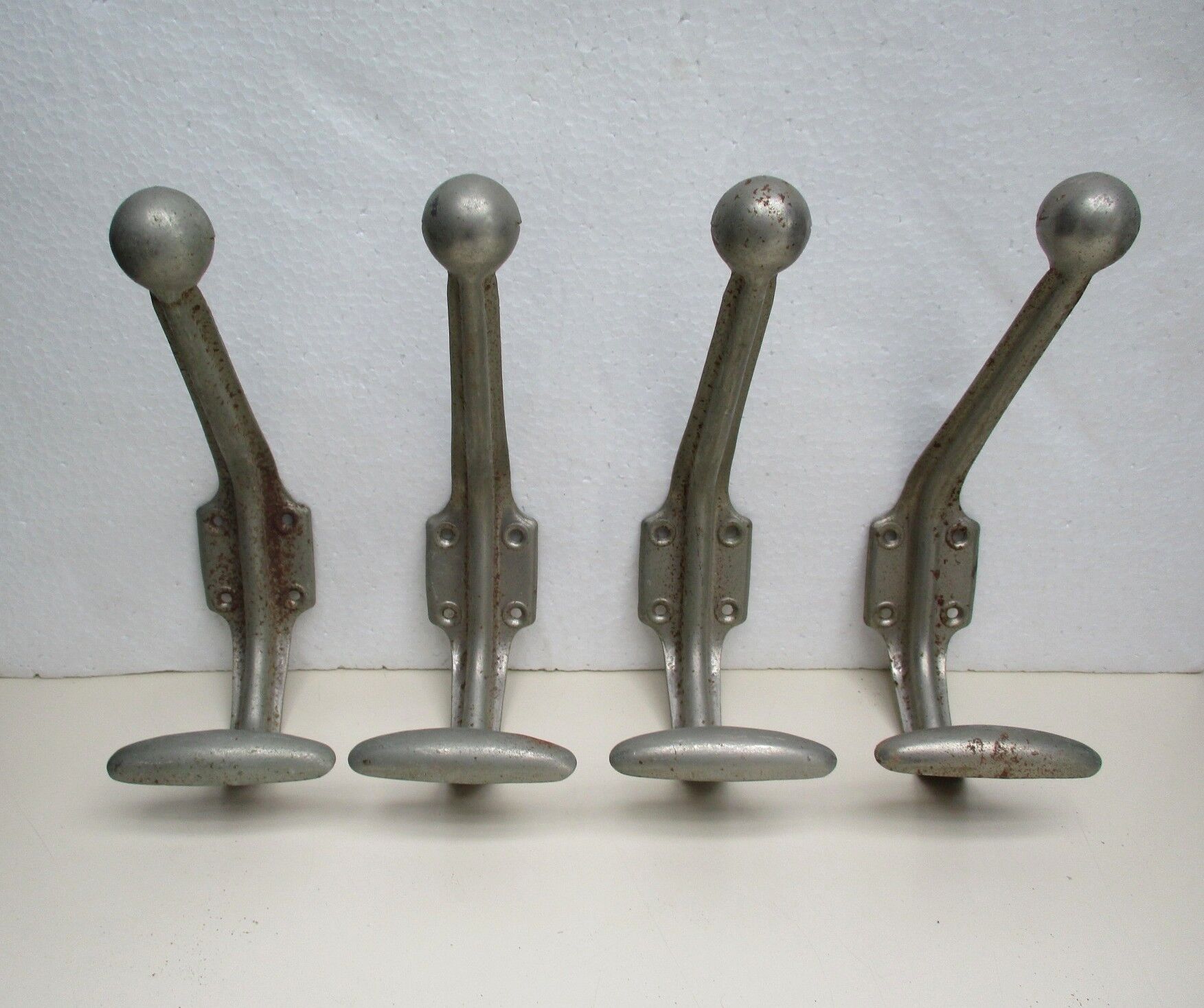 Four industrial iron hooks