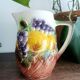 St-Clément pitcher in slip, fruit decoration