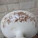 Flat serving compote dish in Terre de Fer HB & Cie with brown floral decoration.