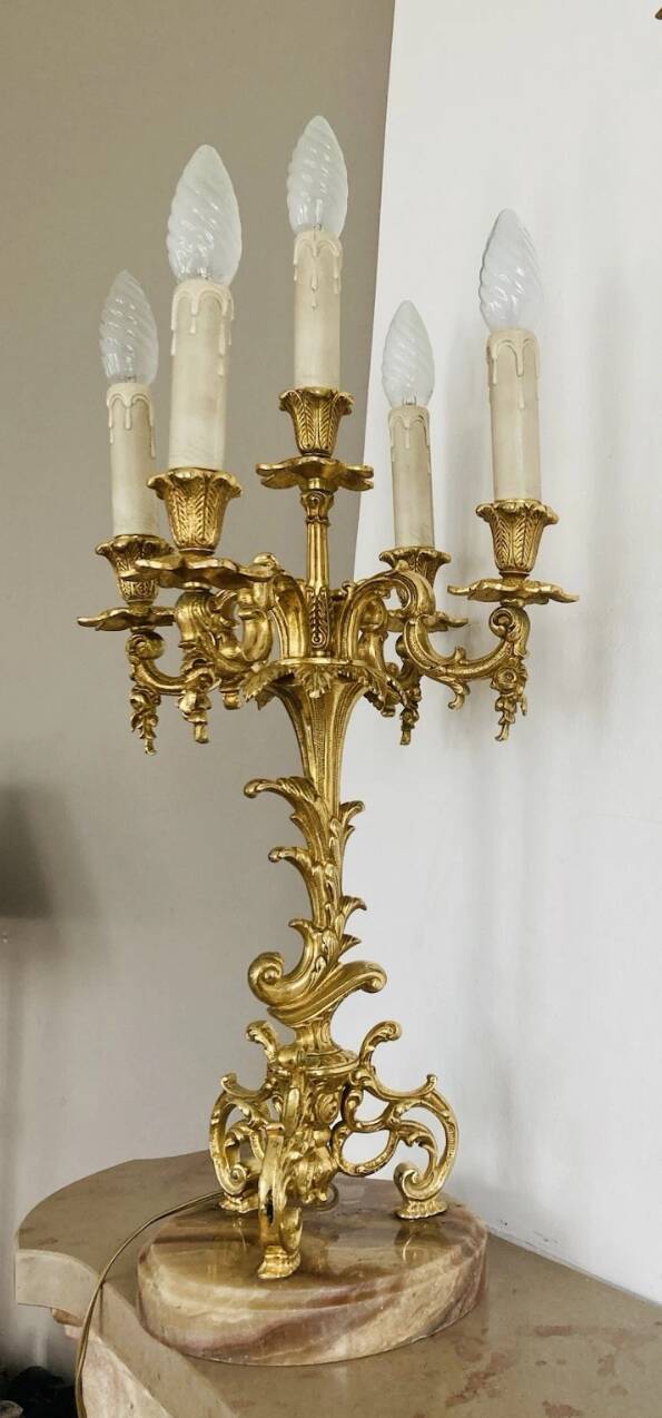 Pair of gilt bronze chandeliers, marble bases.