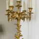 Pair of gilt bronze chandeliers, marble bases.