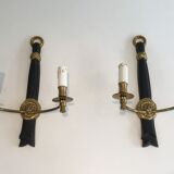 Pair of black lacquered bronze wall sconces decorated with lion heads