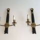 Pair of black lacquered bronze wall sconces decorated with lion heads