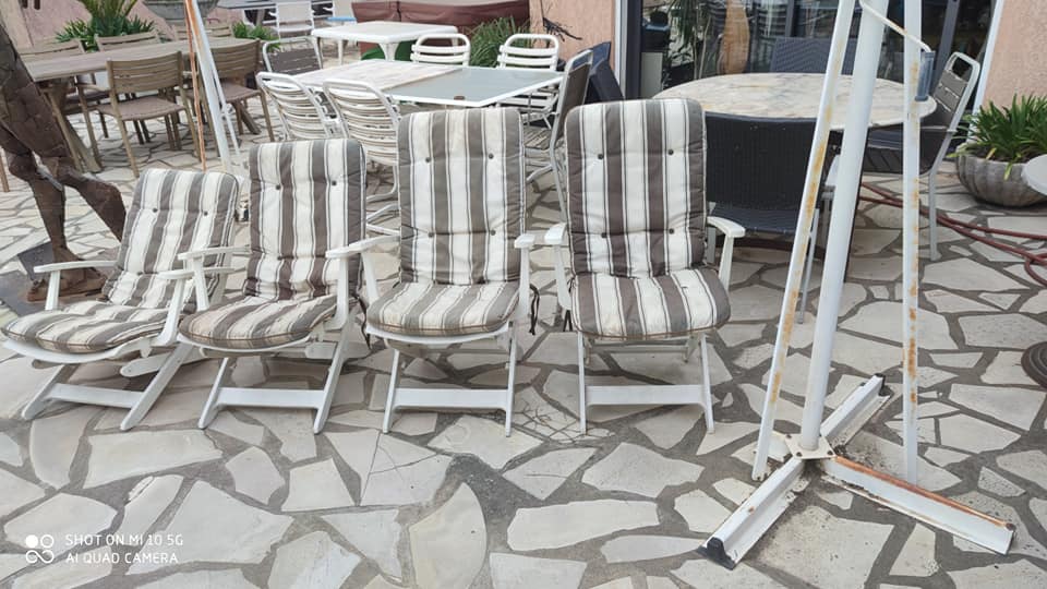 Four Grosfillex armchairs