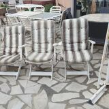 Four Grosfillex armchairs