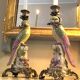 Pair of porcelain candlesticks with parrots and bronze mounts.