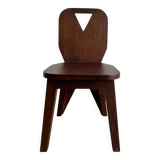 Retro brutalist chair in dark solid wood