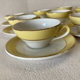 Yellow and white cups and saucers with gold trim Moulin des loups