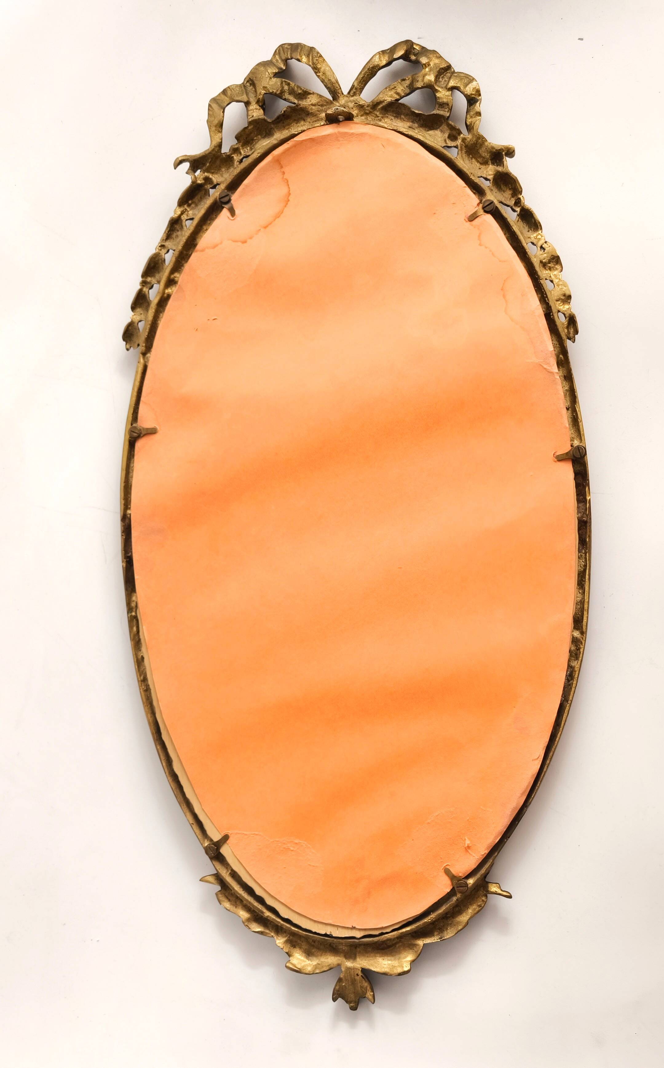 Bronze mirror in Hollywood Regency style from the 1940s/50s.