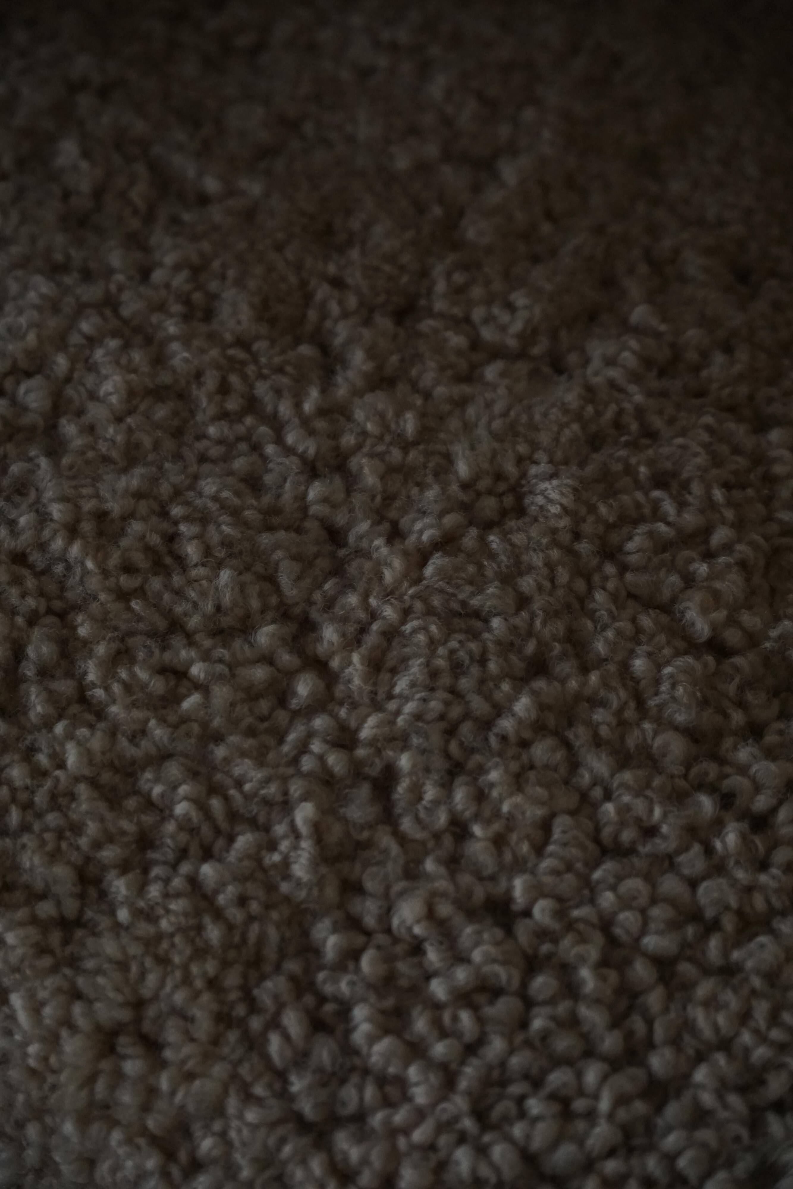 Pair of Danish Art Deco modern lounge chairs in sheepskin with lambswool and elm, 1940s.