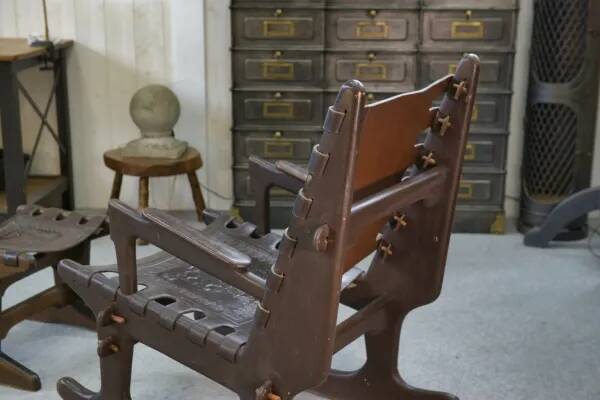 Armchair with ottoman by Angel Pazmino in wood and brown leather 1960's