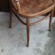 Curved wooden armchair