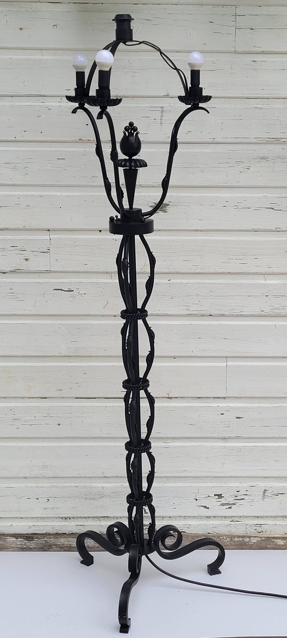 Black wrought iron floor lamp attributed to Gilbert Poillerat