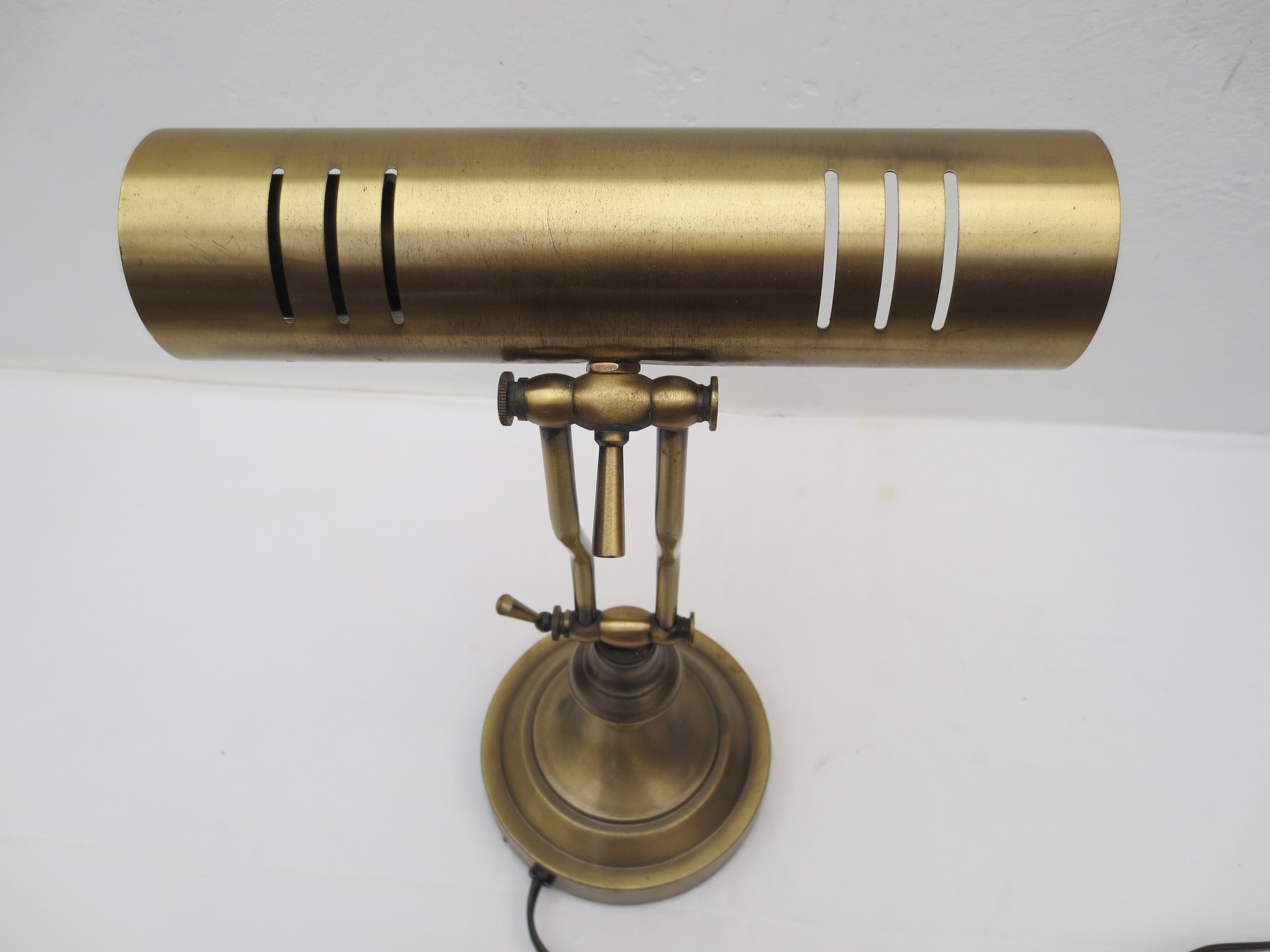 Old aged brass articulated desk lamp
