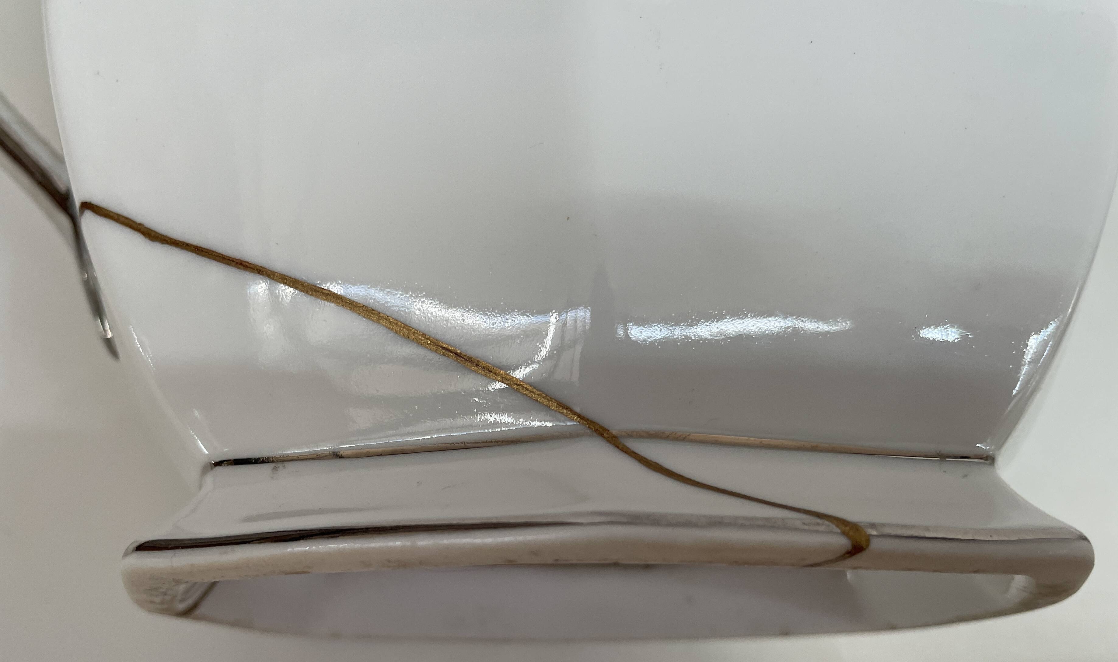 Art Deco service, porcelain with platinum, Kintsugi restoration.