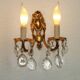 Pair of antique 2-light wall sconces in bronze with crystal pendants, Spain.